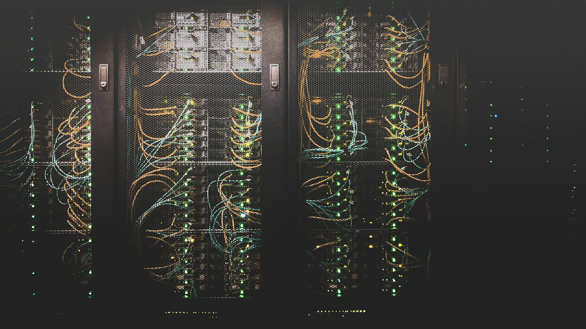 Server racks with dense network cabling in a dark data center